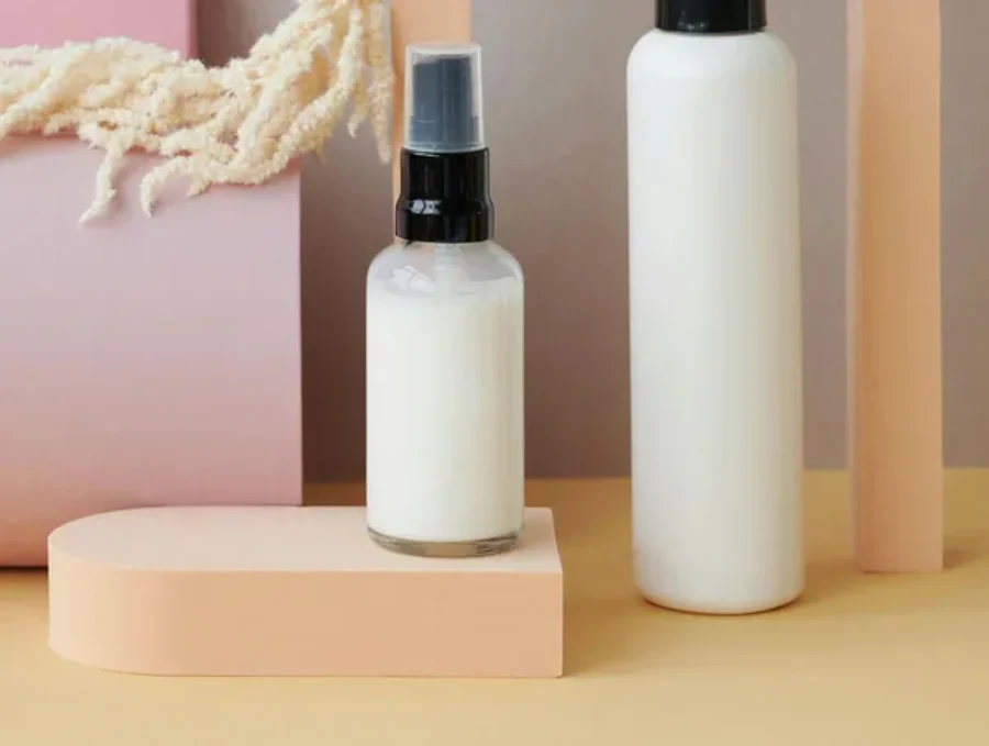 Cosmetic serum bottle on textured stone For the page: Cosmetic Claude 19. Use realistic, professional photography. Match the composition, crop, and visual role