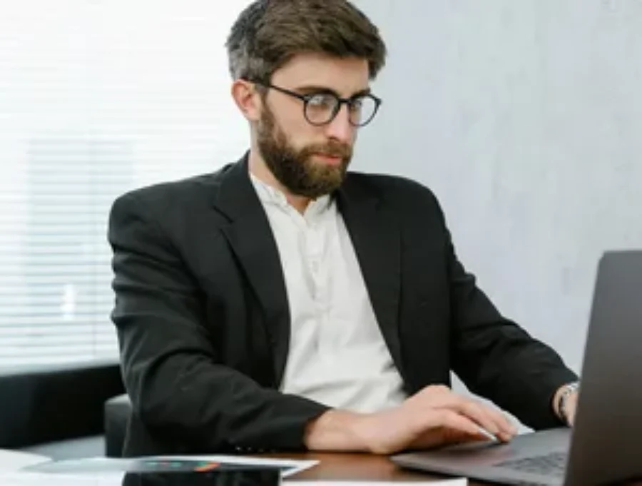 Male attorney in suit For the page: Lawyer Claude 4. Use realistic, professional photography. Match the composition, crop, and visual role of the mockup region.