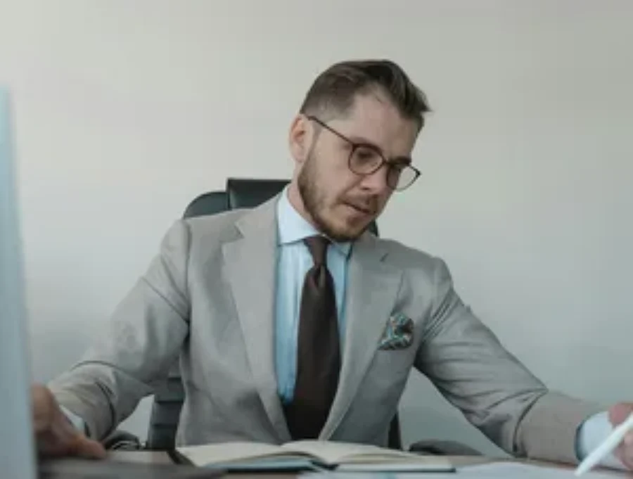 Female attorney in suit For the page: Lawyer Claude 3. Use realistic, professional photography. Match the composition, crop, and visual role of the mockup regio