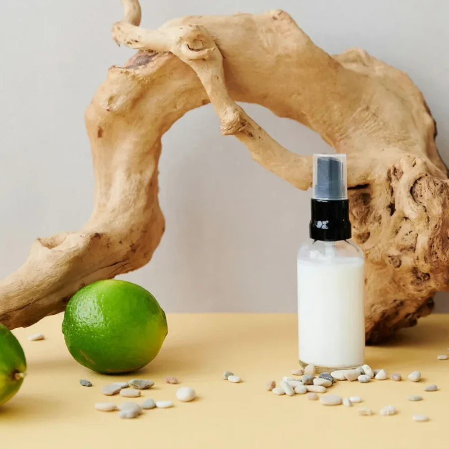 Cosmetic serum bottle on textured stone For the page: Cosmetic Claude 17. Use realistic, professional photography. Match the composition, crop, and visual role