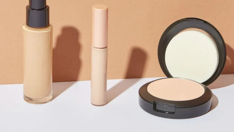 Cosmetic serum bottle on a textured stone pedestal For the page: Cosmetic Claude 13. Use realistic, professional photography. Match the composition, crop, and v