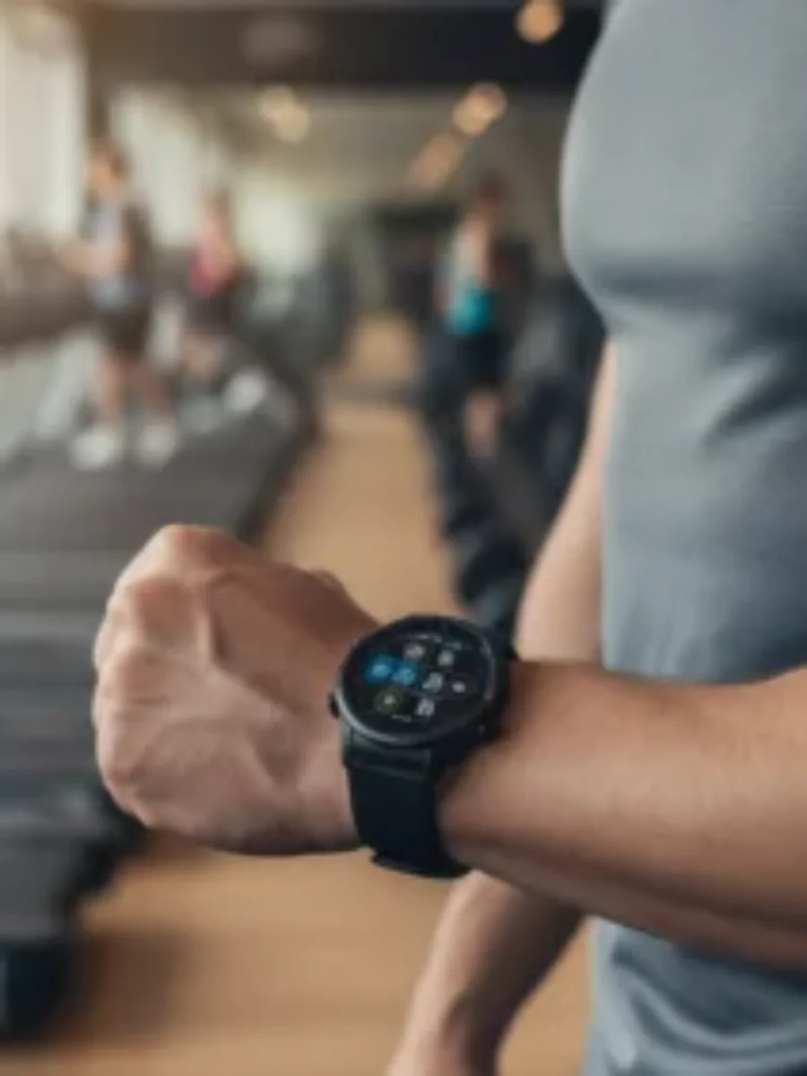 Fitness watch fitness center shot For the page: Influencer 3. Use realistic, professional photography. Match the composition, crop, and visual role of the mocku